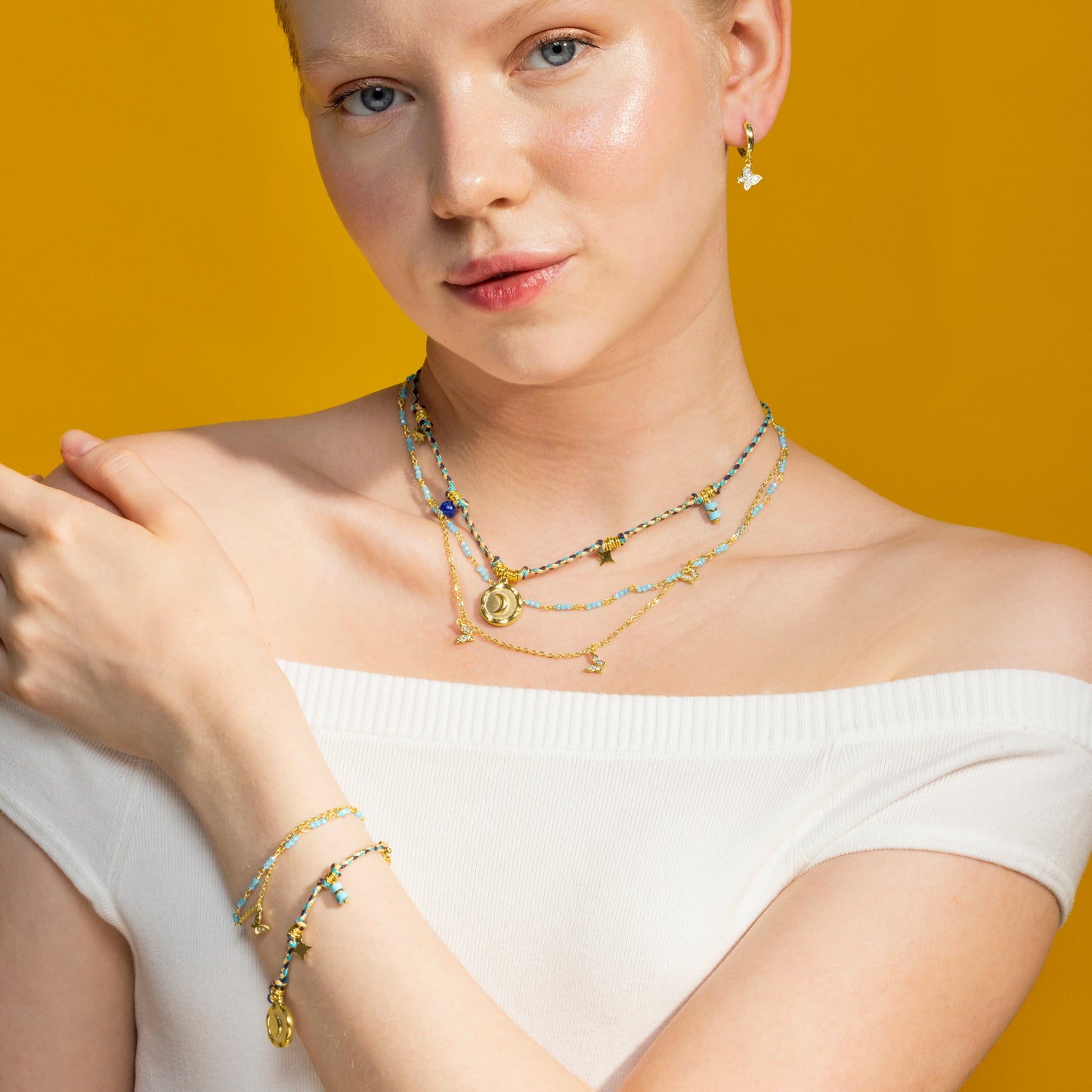 Pulsera con Cristal Azul acabado oro 18k - Zinli